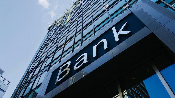 Looking up at a bank’s glass office tower