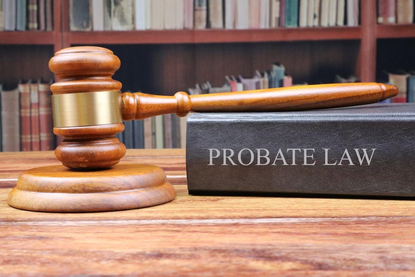 A gavel resting on a book titled Probate Law